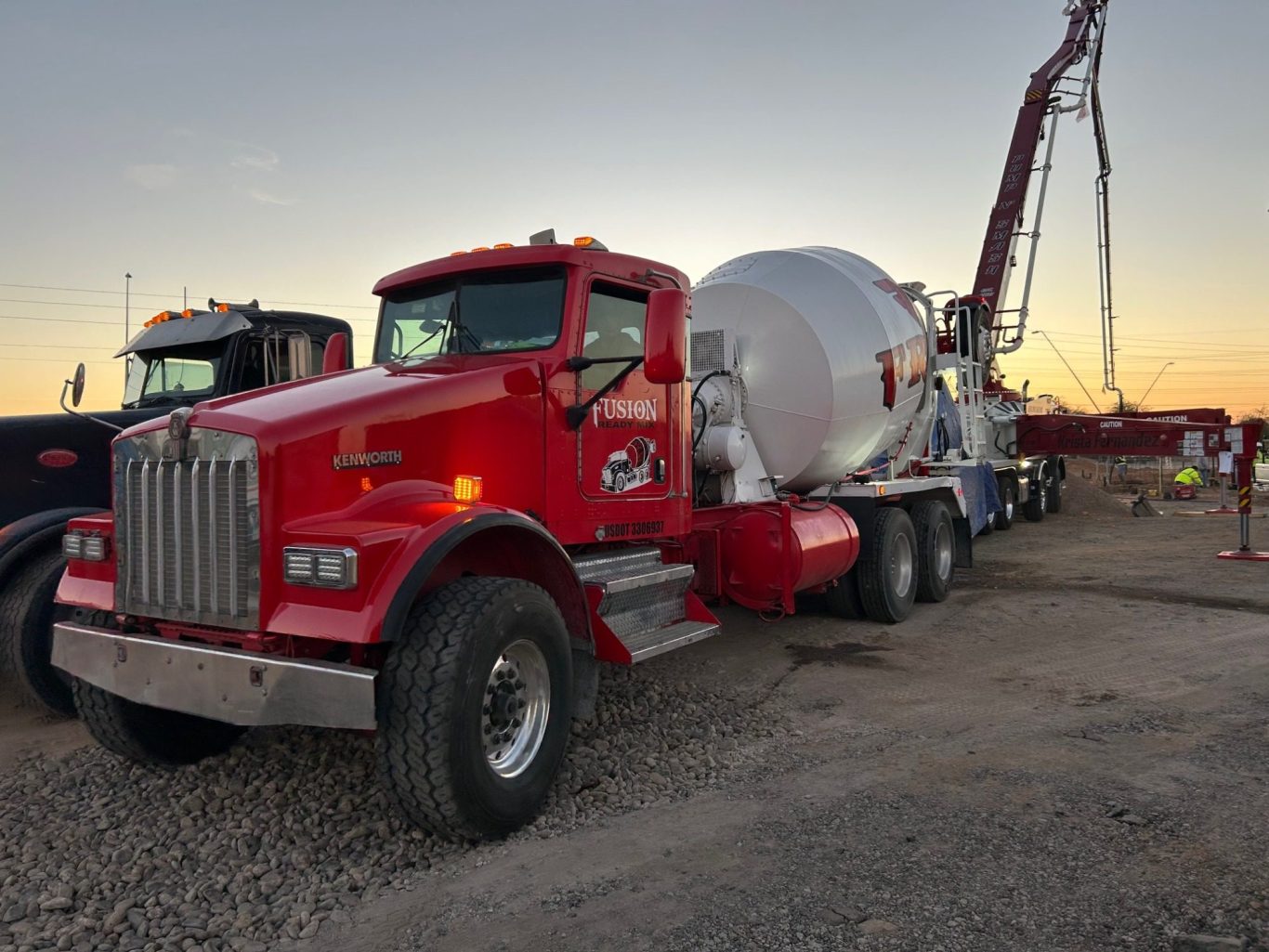 Mixer truck pouring into a boom pump